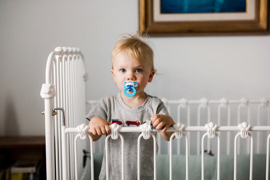 Toddler Standing In A Crib After A Nap