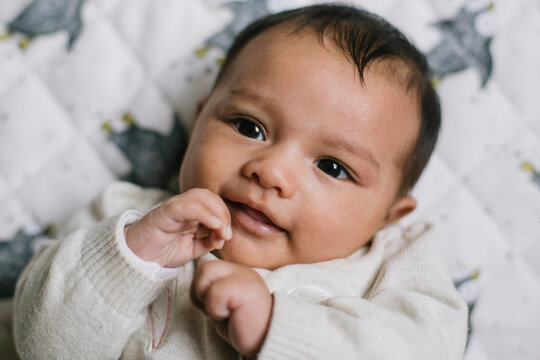 Baby on White Blanket