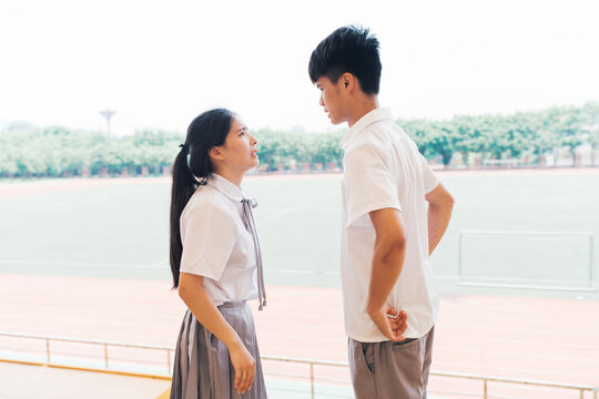 Young Asian college couple arguing