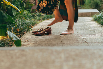 Young woman with red shoes