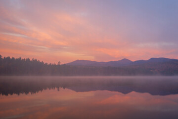 Fototapeta na wymiar Pink sunrise over Lake Chocoroa, Tamworth, New Hampshire, USA
