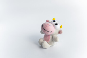 Children's soft toy bull, on a white background. A cute toy for children's games. Symbol of the new year 2021.Copy space