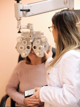 Young optometrist examining pacient