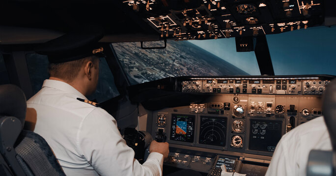 Aircraft pilot controlling landing plane