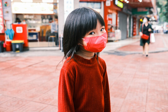 Little girl wearing a mask