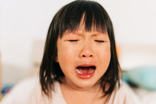 Asian Little Girl Crying With Tears In Her Face