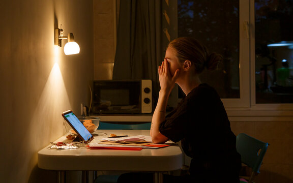 Exhausted female working in kitchen