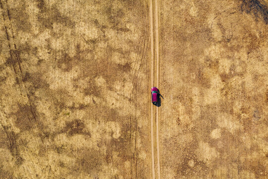Car riding through deserted terrain