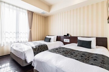 King size twin beds in a luxurious bedroom