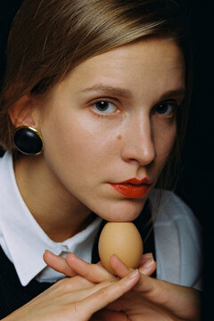 Portrait of a girl with an egg