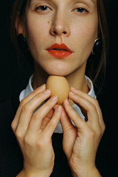 Portrait of a girl with an egg