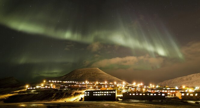 Panoramic view, northern lights, aurora borealis, above the town of Longyearbyen, Spitsbergen, Svalbard, Norway, Europe