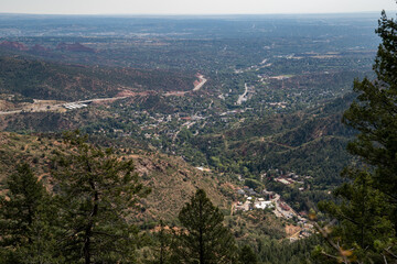 Fototapeta na wymiar Overlooking the city of Manitou Springs Colorado, from the Barr Trail to Pikes Peak, on a hazy, smokey day