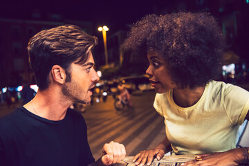 Close-up of angry couple arguing at date night