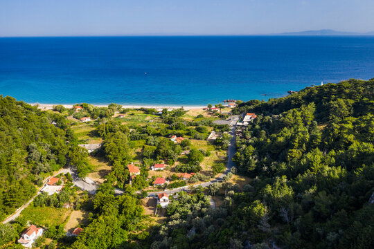 Aerial view of houses on shore of Samos island with Potami Beach in background