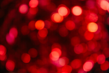 red bokeh on a black background, out of focus, red background, blurry background, round lights in out of focus, horizontal