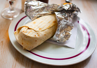 Image of shawarma with chopped vegetables and greens, nobody