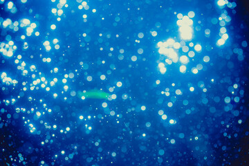 Abstract blue defocused bokeh of lights in dark