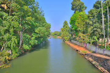 Fototapeta premium A canal passing through a town in Alappuzha, Kerala