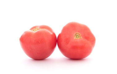 Two fresh tomatoes on white background