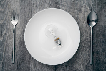 the vintage light bulb above a white dish