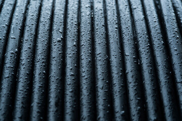 water drop on the black electric cable background