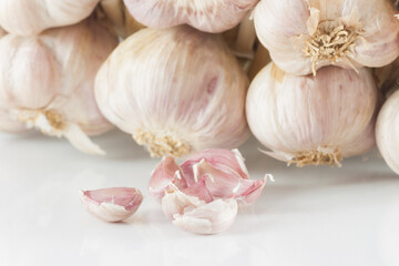  White garlic head heap and Garlic cloves