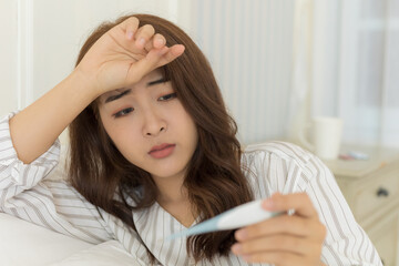 Young Asian women have headache