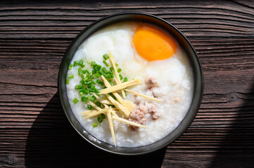 Rice gruel or congee with egg ,pork and vegetable