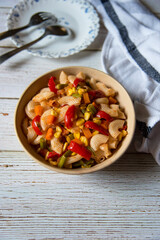 Popular food ingredient home made pasta in a bowl along with condiments.