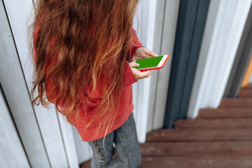 Teenager girl playing in iphone chromakey