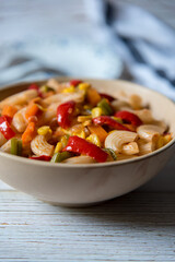Close up delicious pasta with vegetables with use of selective focus.
