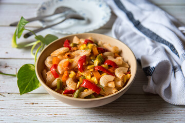 Popular Italian dish macaroni pasta in a bowl on a background.