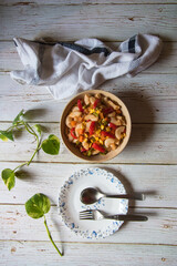 A bowl of pasta on a background.