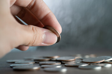 Hand holding coin, Business and financial saving.