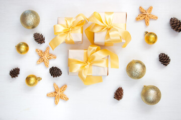 Christmas composition. Gift, fir branch, Christmas decorations on a white background. Flat lay, top view, copy space. Winter festive concept.