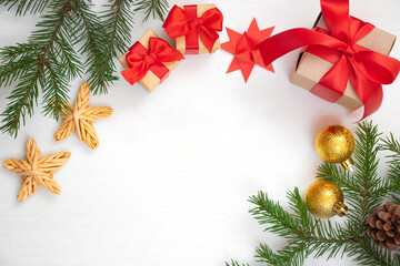 Christmas composition. Gift, fir branch, Christmas decorations on a white background. Flat lay, top view, copy space. Winter festive concept.