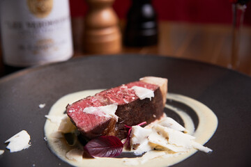 Ribeye with white truffle slides in high cuisine restaurant