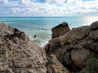 Bright turquiose Mediterranean Sea and the Rock of Aphrodite, where this Ancient Greek Goddess of...