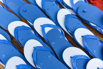 Blue and white flip flop on wooden background - Slippers flipflops