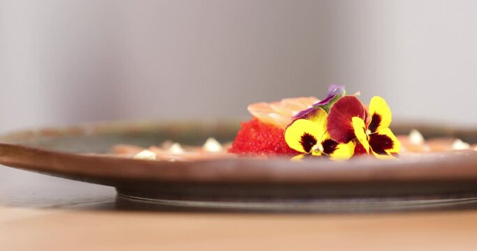 Food Plating - Pancy Flowers Put On The Sashimi Salmon Rose With Red Caviars As Garnished. - selective focus, sliding slow-mo shot