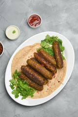 indian chicken tikka shish kofte kebabs. Delicious homemade Indian Starter Mixed Vegetable Kebab Platter dipped in mayonnaise coriander leaf. Seekh Kebab grilled meat skewers, Turkish and Arabic food.