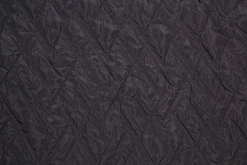 Quilted fabric. The texture of the blanket.	
