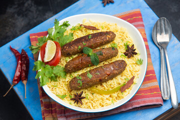 Seekh Kebab Biryani , indian chicken tikka shish kofte kebabs. Delicious homemade Indian Vegetable Kebab Platter basmati rice mayonnaise coriander leaf.  grilled meat skewers, Turkish and Arabic food.