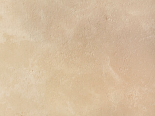 Beige low contrast smooth decorative stone concrete textured background. Abstract soft neutral antique artistic backdrop texture to your concept or product