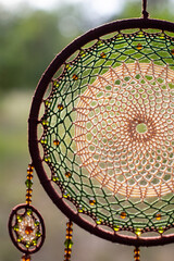 Handmade dream catcher with feathers threads and beads rope hanging