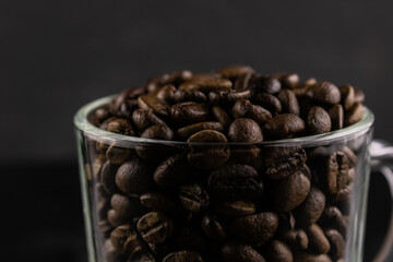 Roasted coffee beans in a glass Cup