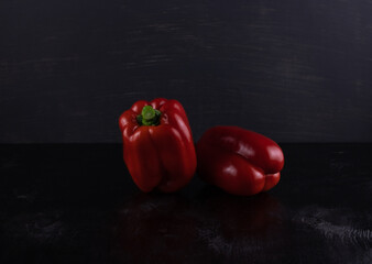 Two red ripe sweet peppers