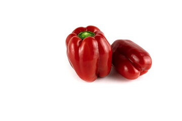 Two red ripe sweet peppers