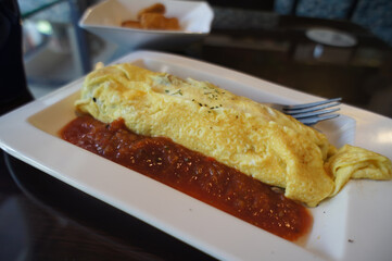 Close up shot of Omelette with sauce